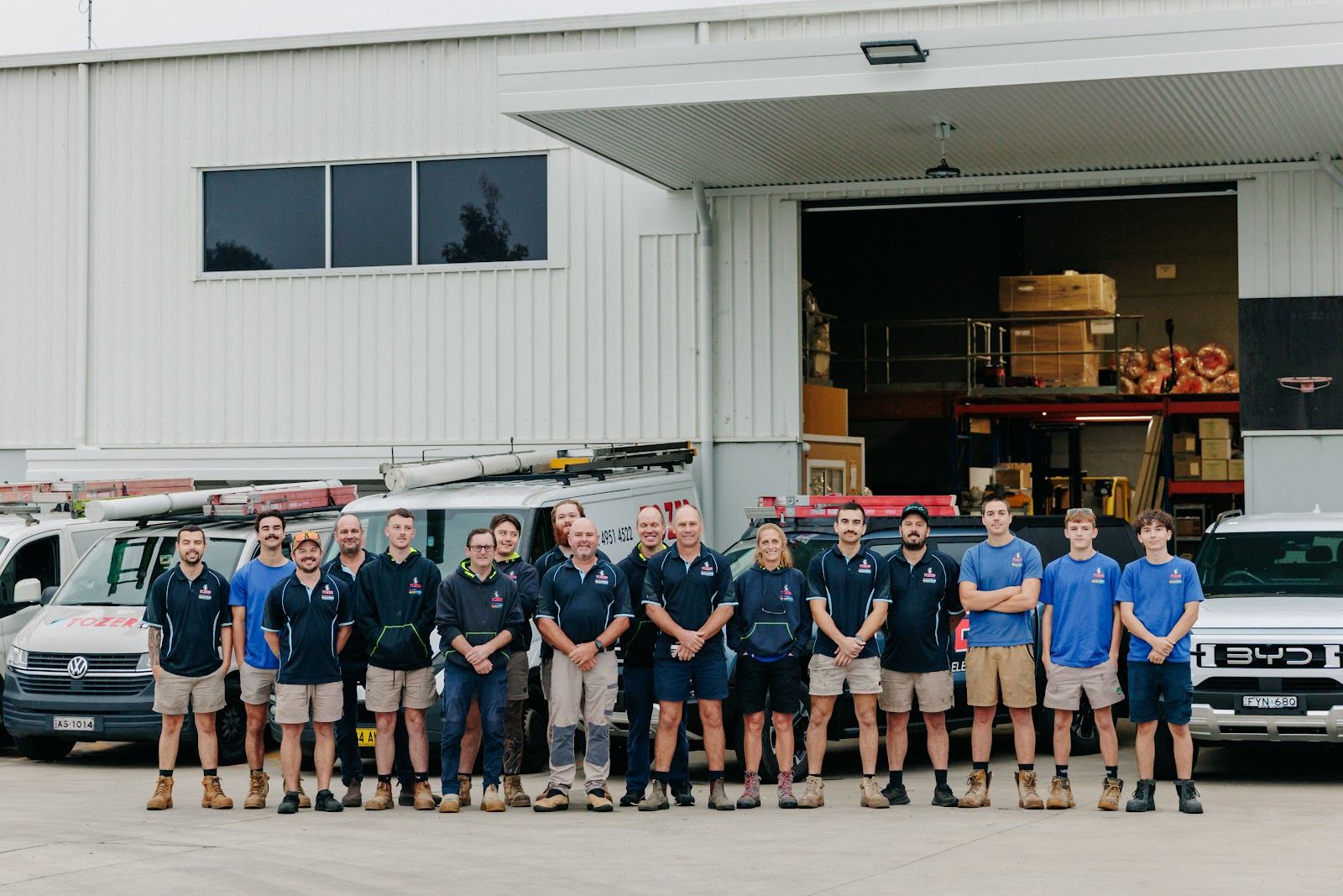 The full TOZER crew lined up in front of the Beresfield warehouse