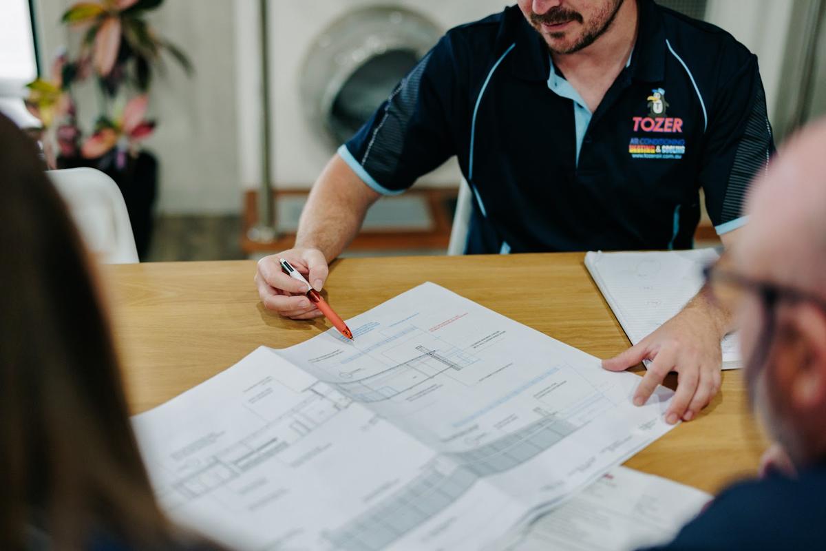 The team planning a commercial job over drawings